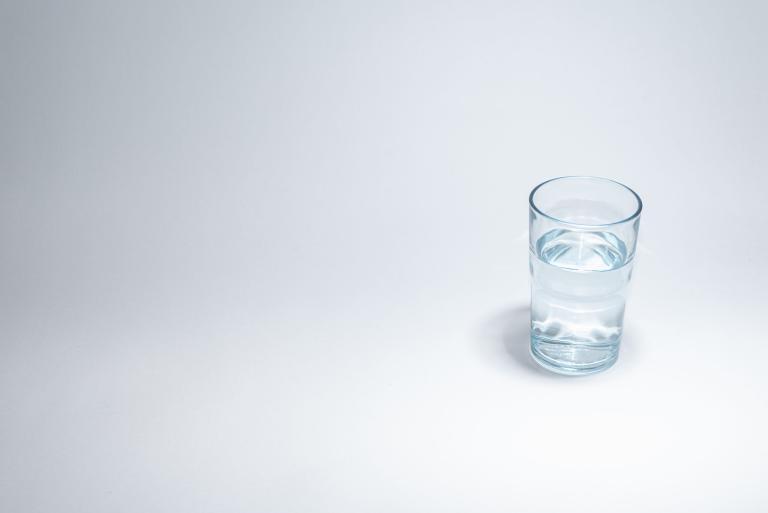Traditional glass cup over white background